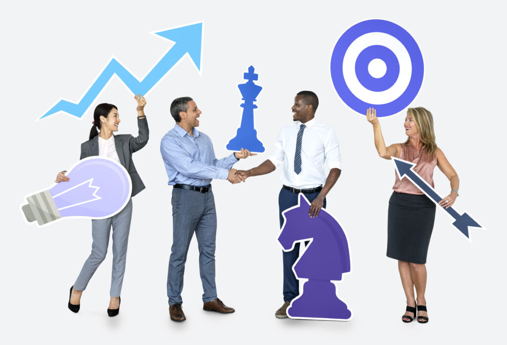 The Imperative Role of Transcription in Modern Business Strategy. A blog post by OutSec the UK's leading online transcription company. Pic shows businessmen and women holding up symbols associated with business strategy.